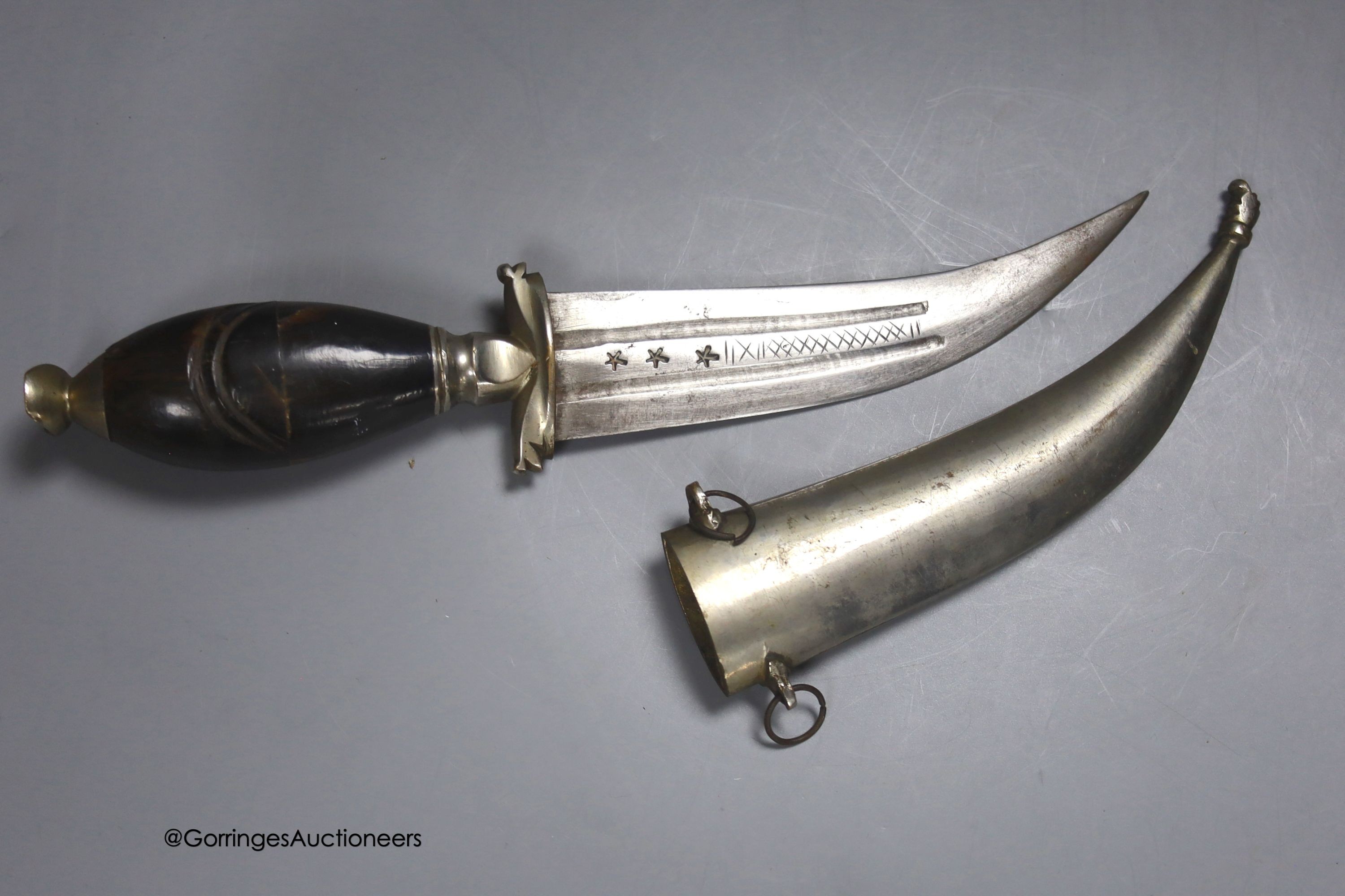 A Middle Eastern dagger, with inlaid horn handle, in sheath